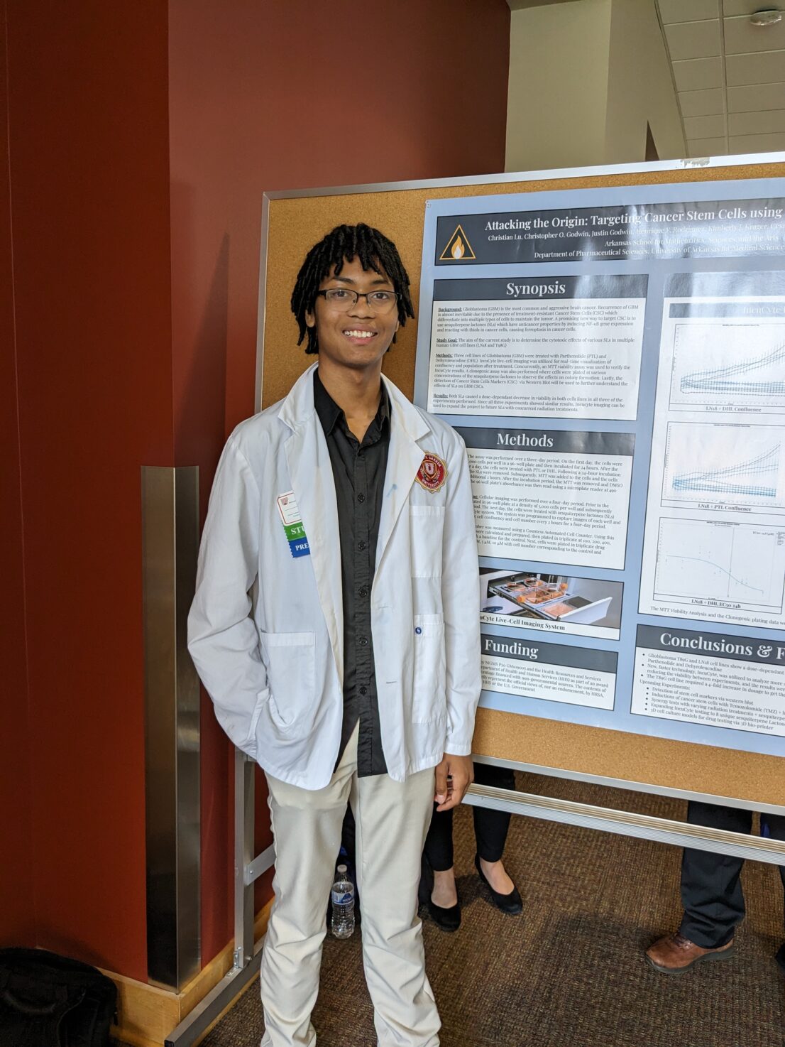 Summer student_Christian standing in front of his poster